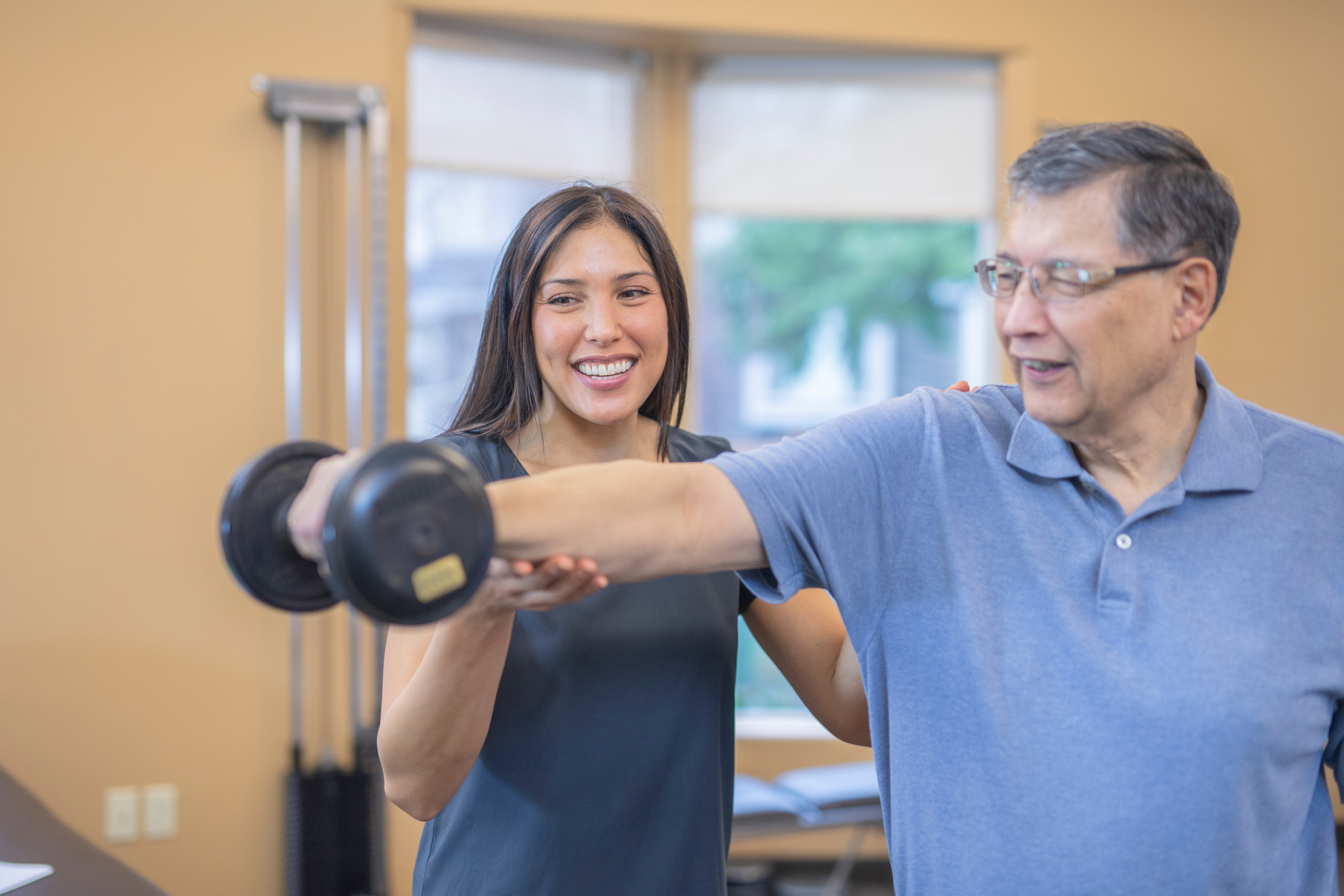 A senior man works with his  occupational therapist