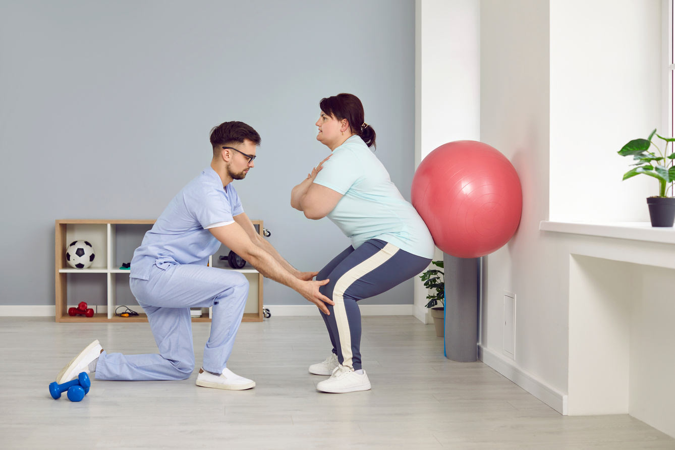 Physical Therapist Guiding a Patient 